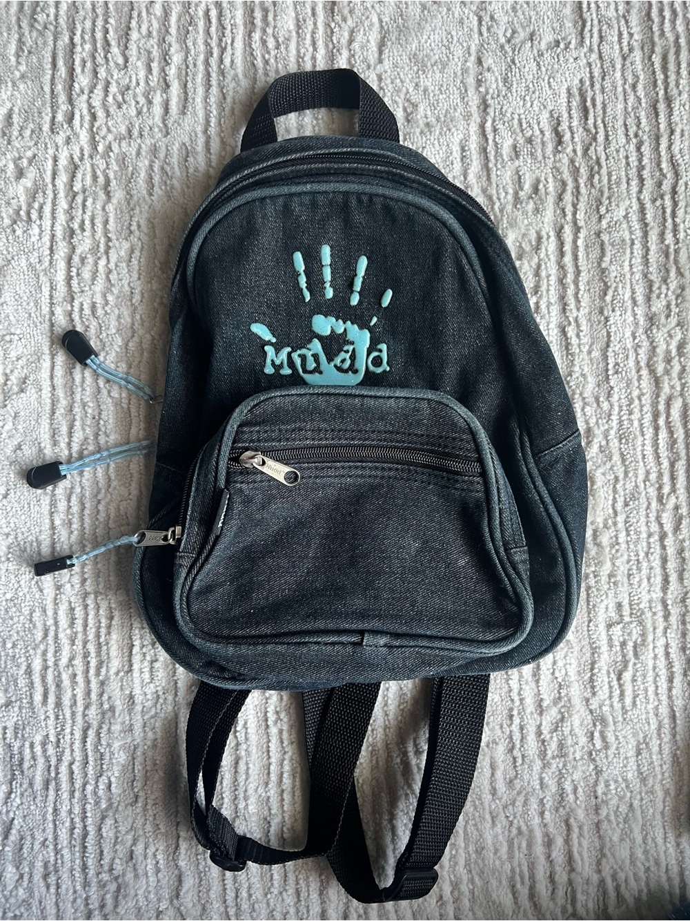 Mudd Black Backpack with Teal Handprint Accent